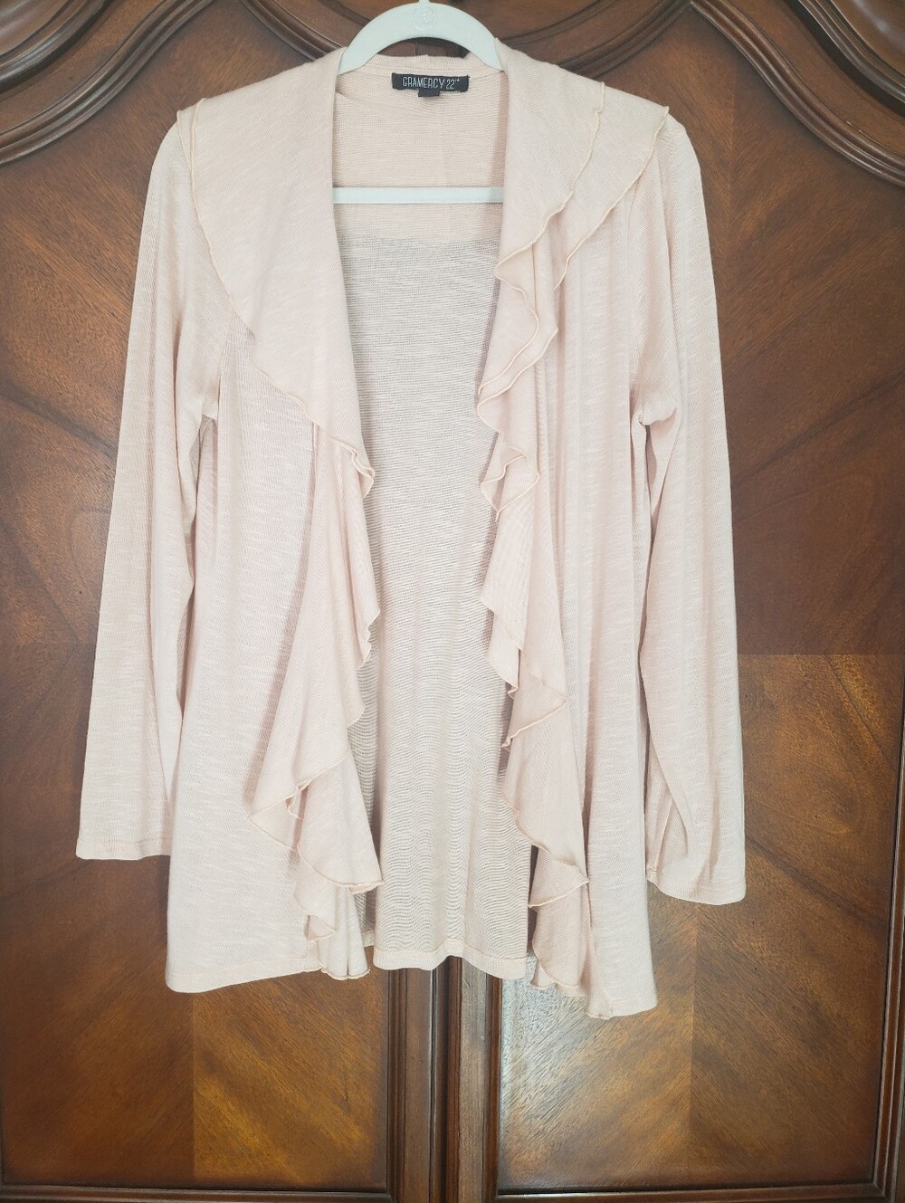 This is a blush pink slub knit open cardigan by Gramercy 22
